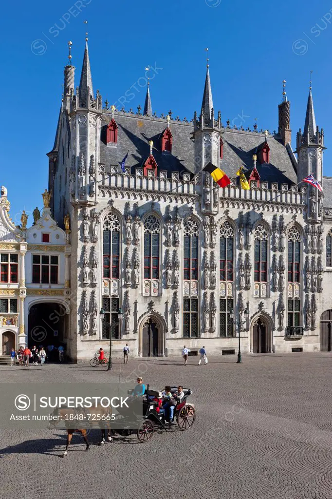 Grote Markt square with Stadhuis, city hall, and a horse-drawn carriage, old town of Bruges, UNESCO World Heritage Site, West Flanders, Flemish Region...