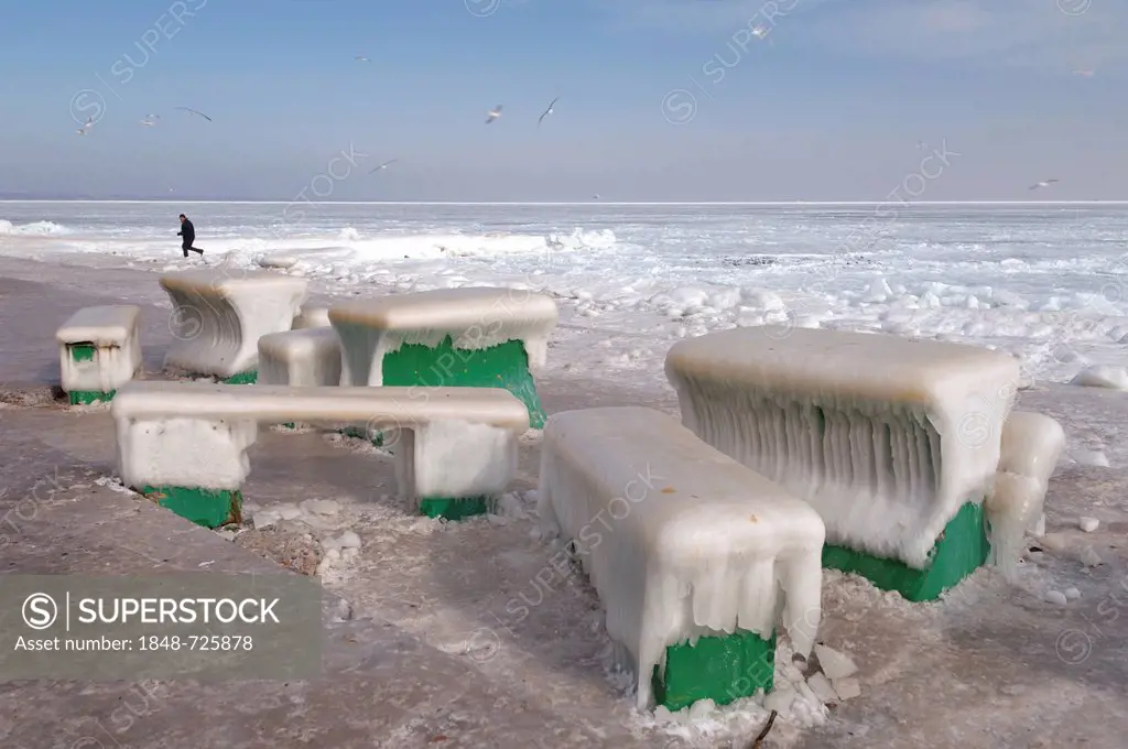 Icy cafe tables and benches on the beach of the frozen Black Sea, a rare phenomenon, last time it occured in 1977, Odessa, Ukraine, Eastern Europe
