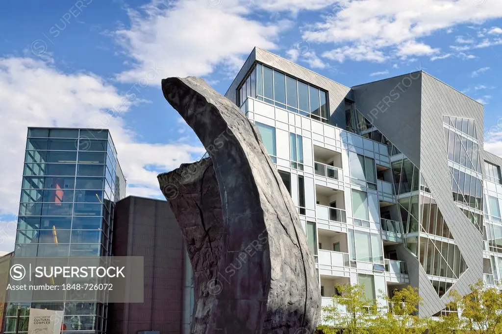 Modern facades of the Museum Residences, residential buildings in the Civic Center Cultural Complex, with a granite sculpture at the front, Denver, Co...