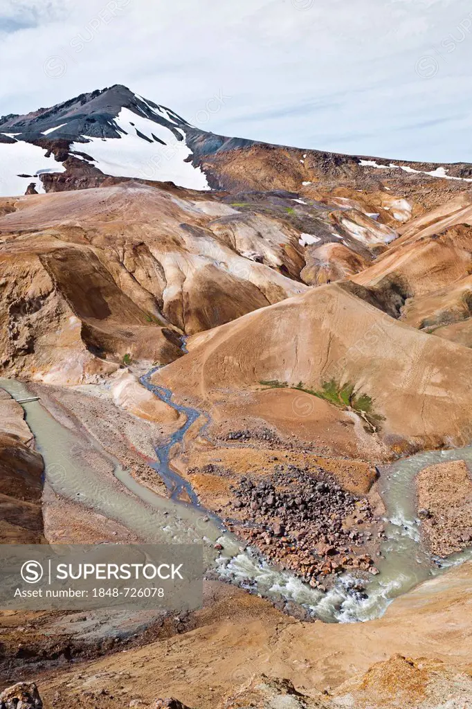 Small river flowing through the colourful hills and rhyolite mountains of the geothermal area of Kerlingarfjoell Glacier in the interior highlands of ...