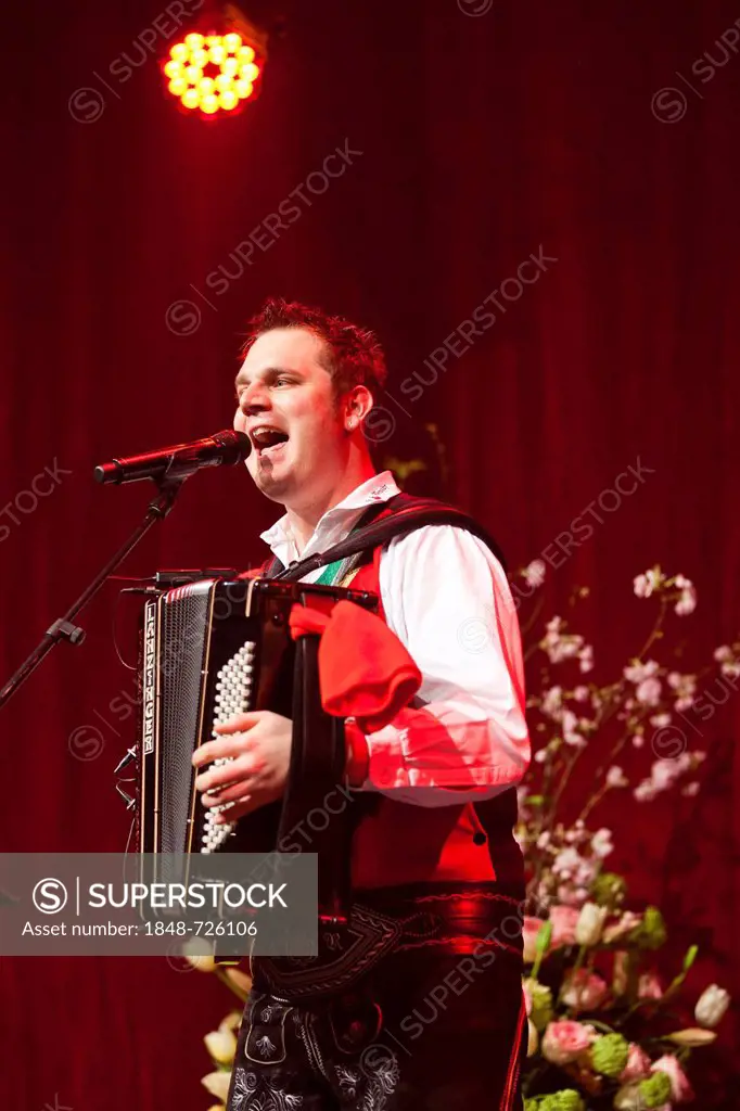 Michael Ringler, accordionist of the Austrian folk music and pop band Die jungen Zillertaler performing live at the Schlager Nacht 2012, pop music eve...