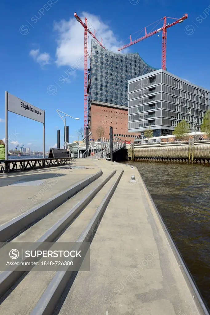 View from the quay to the Elbe Philharmonic Hall under construction and the Johannes-Dalmann-Haus on Dalmannkai waterfront, Grasbrookhafen harbour, Ha...