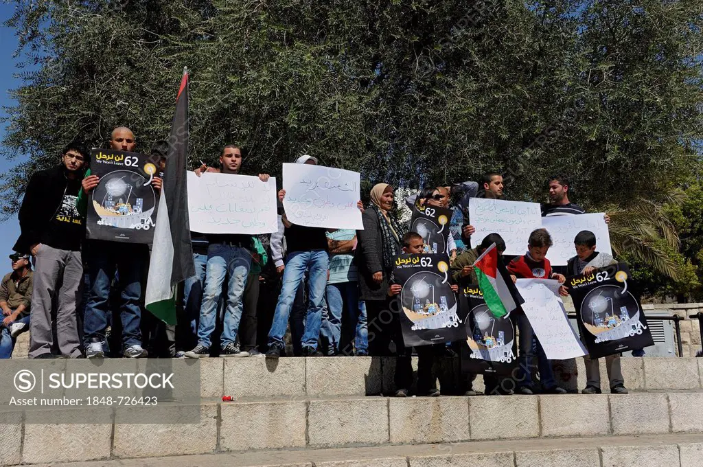Palestinians demonstrating peacefully with placards and posters against the Israeli settlement policy at the Damascus Gate outside the Old City, Jerus...