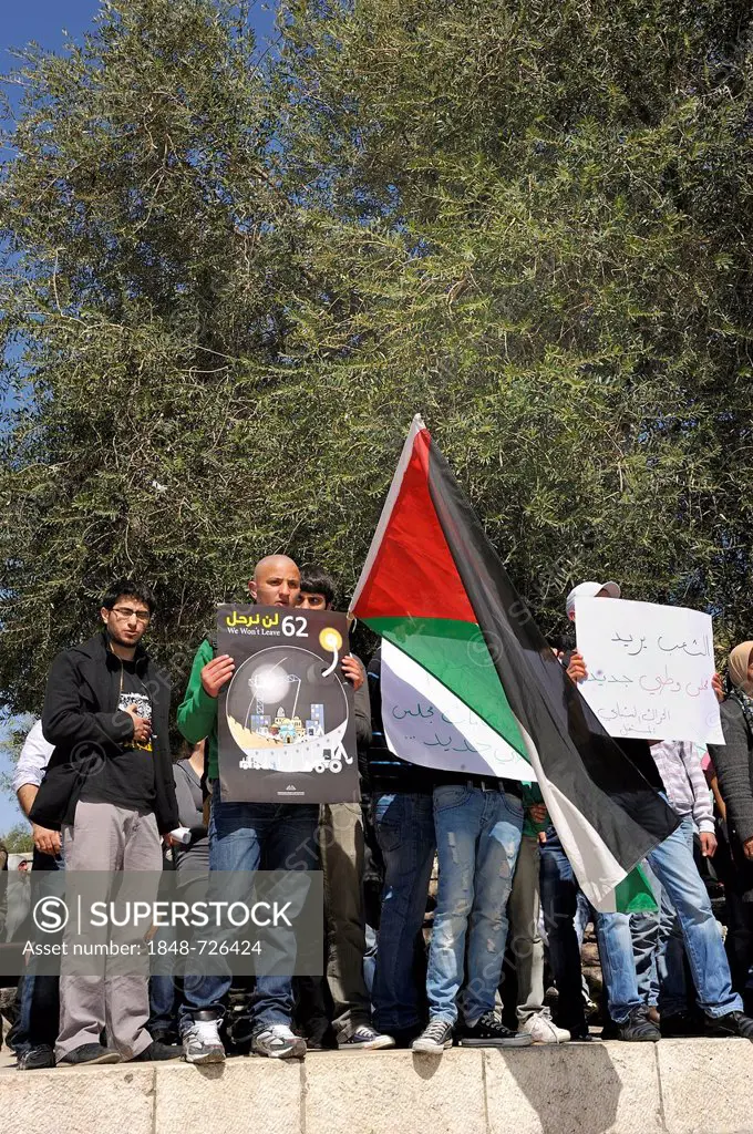 Palestinians demonstrating peacefully with placards and posters against the Israeli settlement policy at the Damascus Gate outside the Old City, Jerus...
