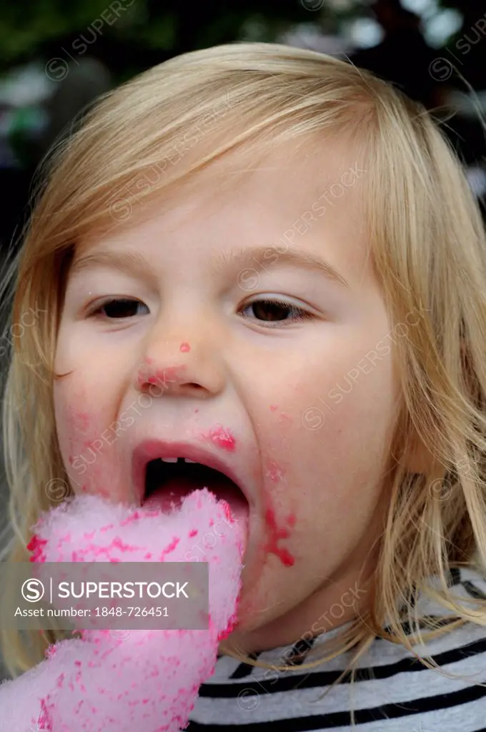 Little girl, three years, eating candy floss, Sweden, Europe