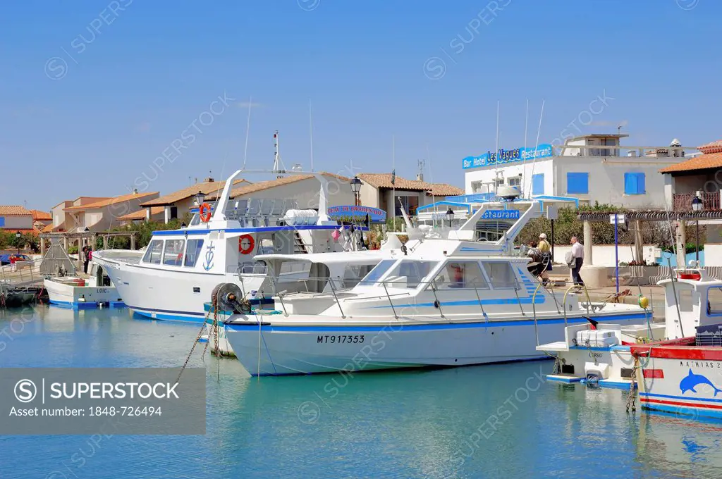 Boats in the harbor of Les Saintes-Maries-de-la-Mer, Camargue, Bouches-du-Rhone department, Provence-Alpes-Cote d'Azur region, Southern France, France...