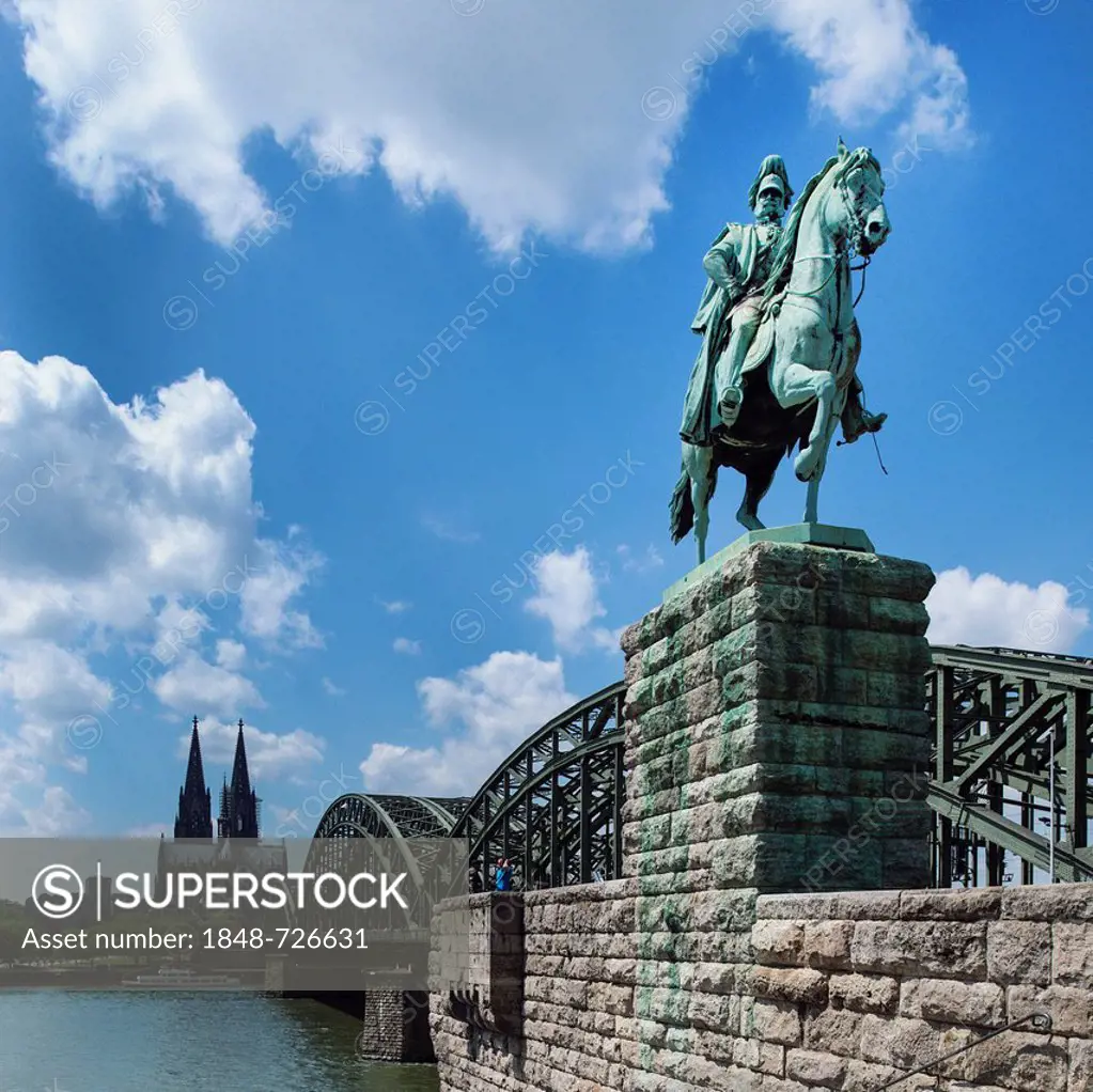 View across the Rhine River from the equestrian statue of Emperor Wilhelm I of Prussia towards Hohenzollern Bridge, Cologne Cathedral and Museum Ludwi...