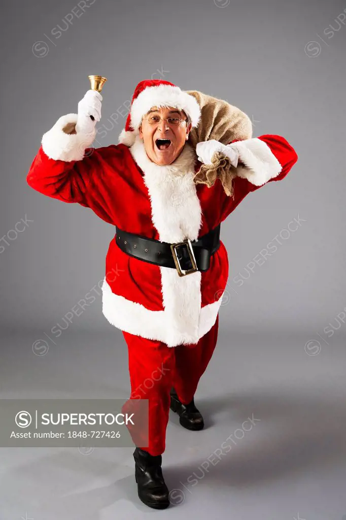 Santa Claus with bag and bell