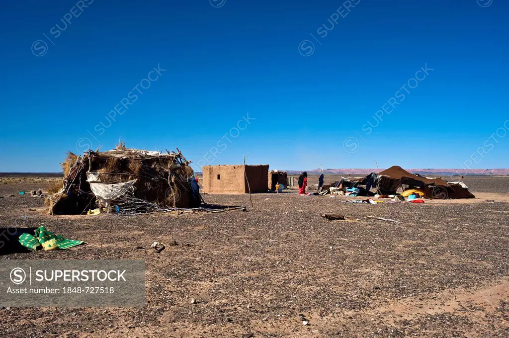 Nomad tent and dwellings of a nomadic family on a plateau, stony desert, hamada, Erg Chebbi, Southern Morocco, Morocco, Africa