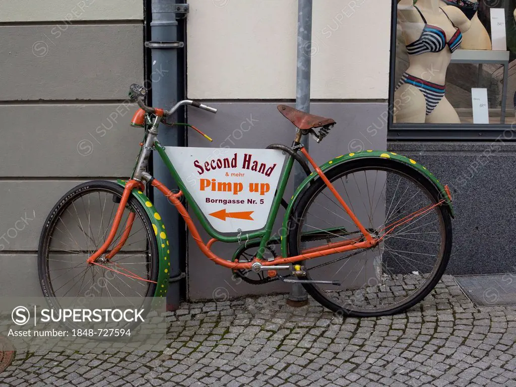 Multicolored bicycle standing in front of a shop, Erfurt, Thuringia, Germany, Europe, PublicGround