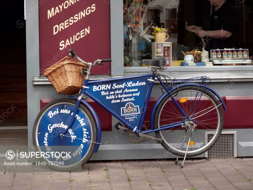 Blue bicycle standing in front of a shop, Erfurt, Thuringia, Germany, Europe, PublicGround