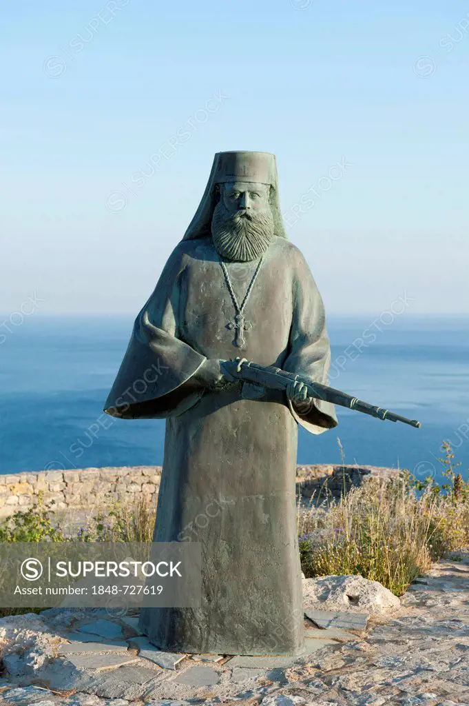 Greek Orthodox Christianity, a bronze statue of an armed monk holding a rifle, monument to the resistance movement at the Monastery of Preveli, Crete,...