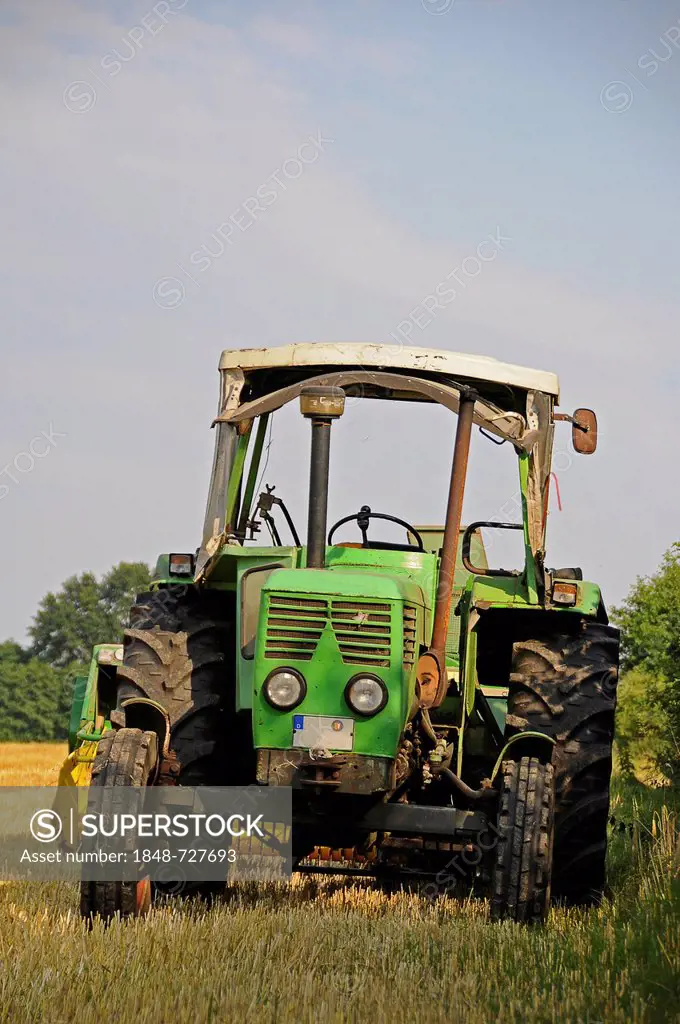 Tractor on a corn field, Tangstedt, Schleswig-Holstein, Germany, Europe, PublicGround