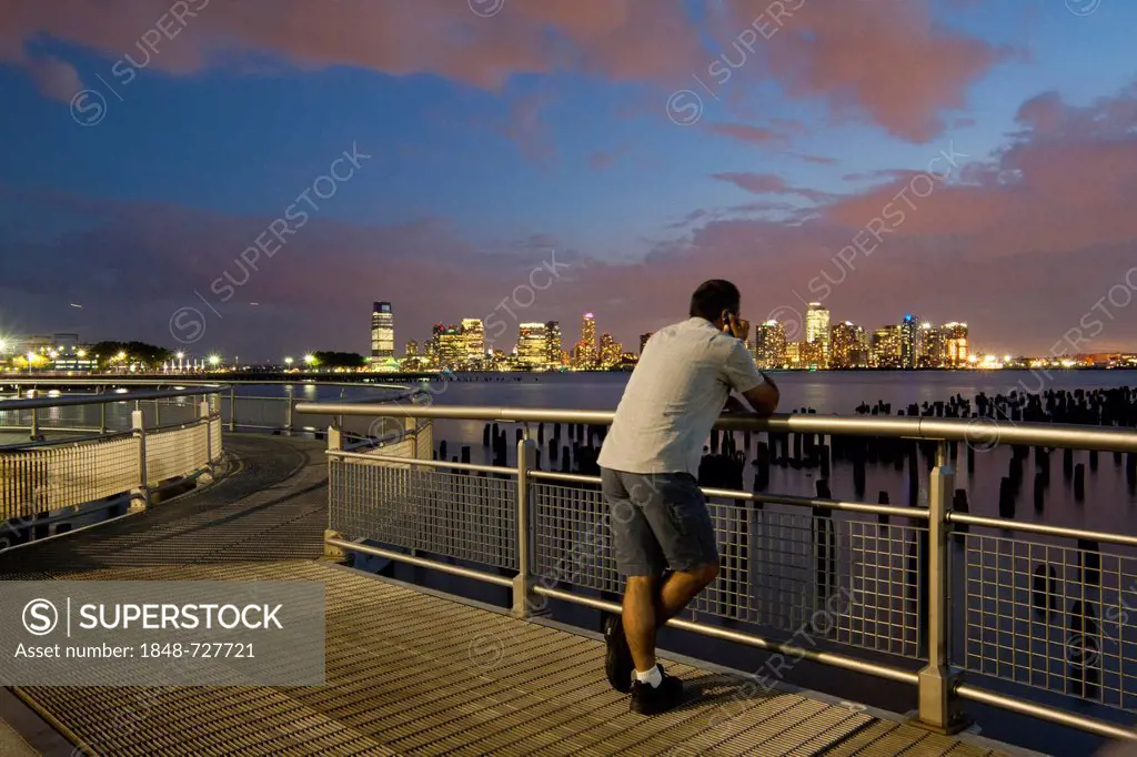 Man looking at the skyline, Hudson River Park, near Pier 45, Greenwich Village, Lower West Side, Manhattan, New York City, USA