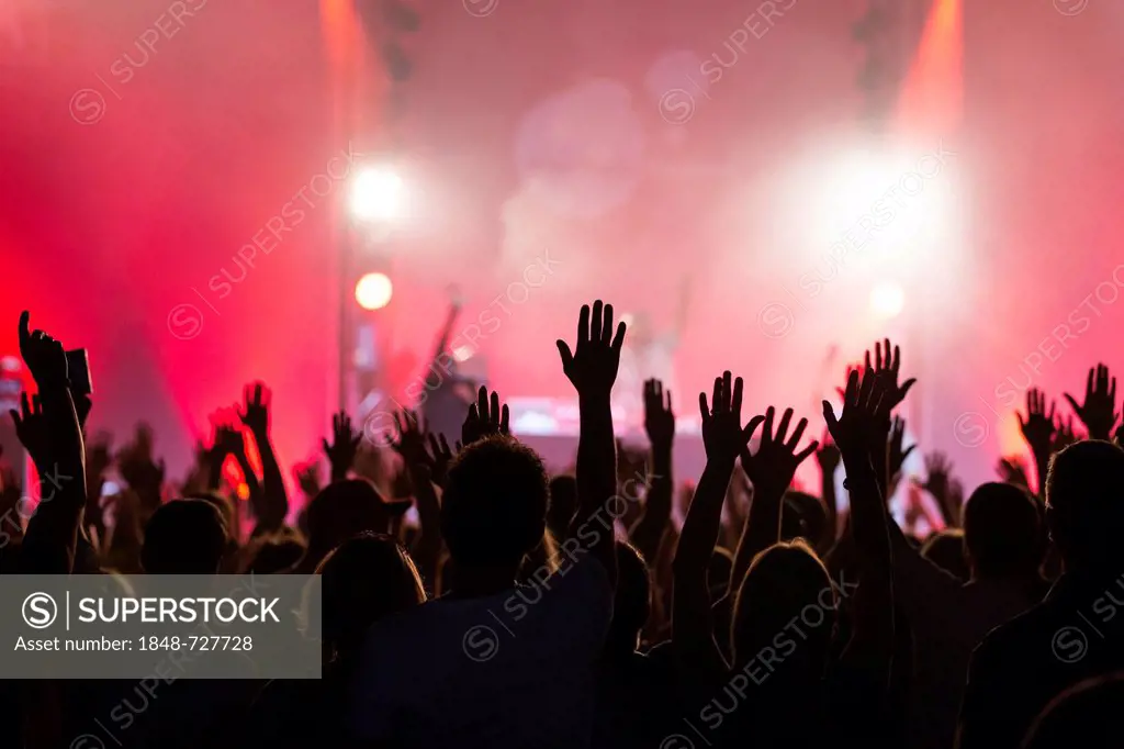 Concert-goers with their hands up in the air during the concert of the U.S.-American hip hop group De La Soul performing live at the Lucerne Hall of t...