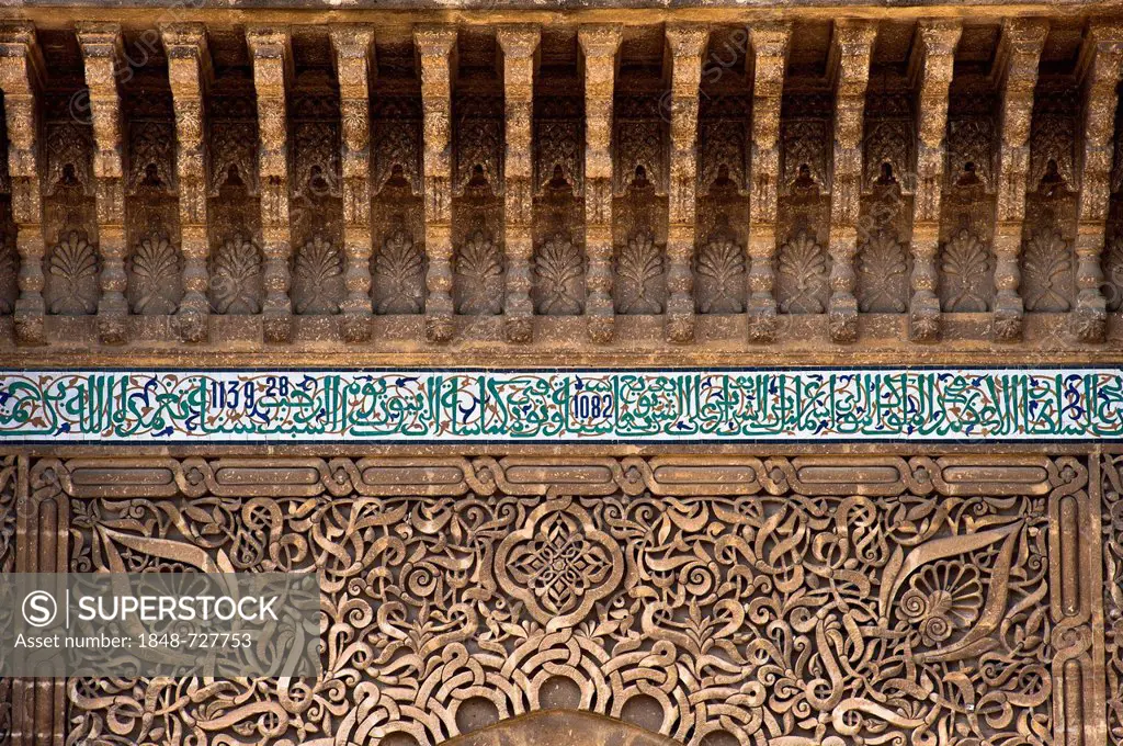 Stucco ornaments and tile mosaics with Koranic verses on the gate to the mausoleum and the Moulay Ismail mosque, Meknes, Morocco, Africa