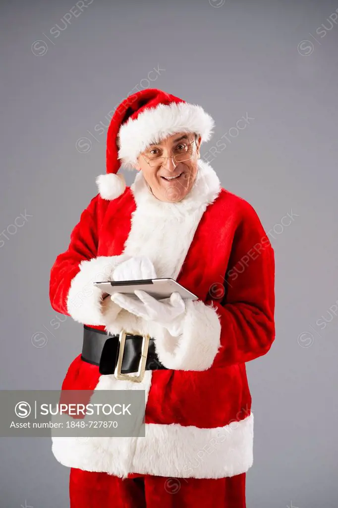 Santa Claus with a tablet PC