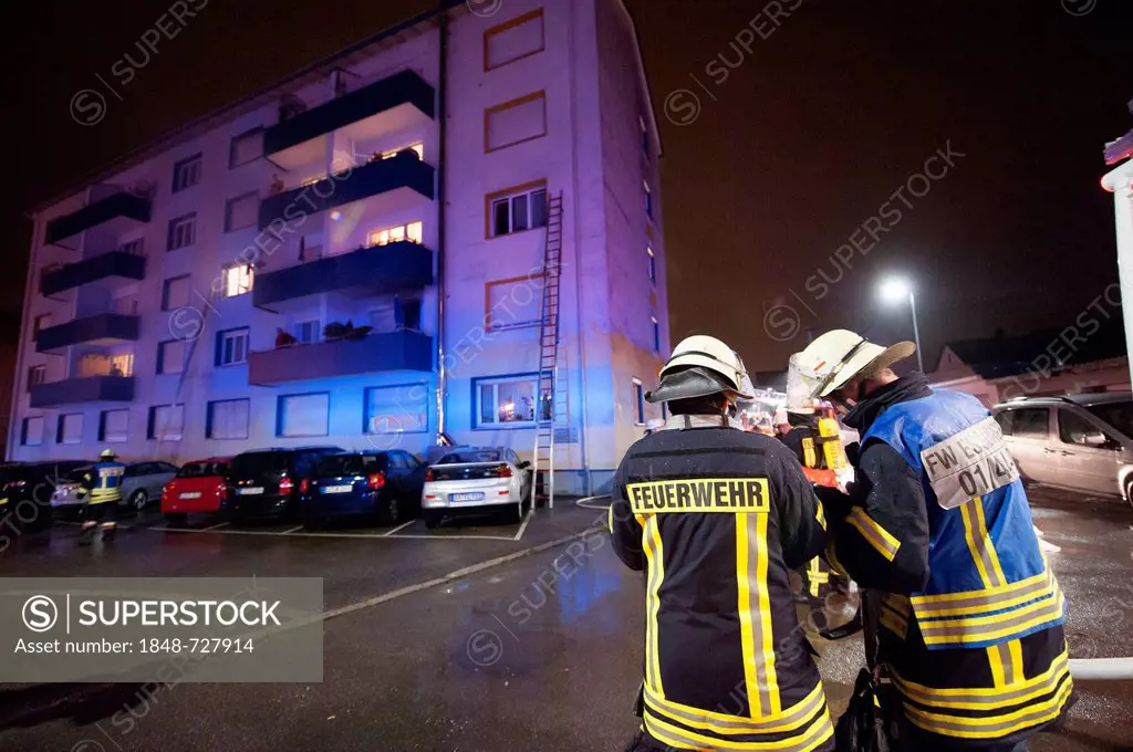 Apartment fire in an apartment building, firefighters takin care of residents, Esslingen, Baden-Wuerttemberg, Germany, Europe