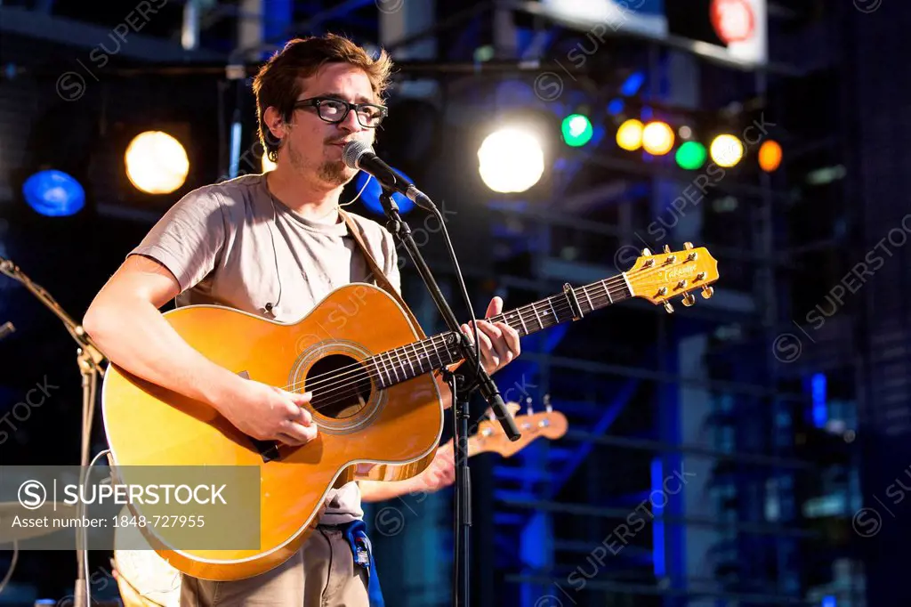 The Swiss singer and songwriter Micha Sportelli live in front of the KKL Plaza at the Blue Balls Festival in Lucerne, Switzerland, Europe