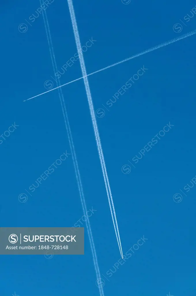 Aircraft with contrails in the sky