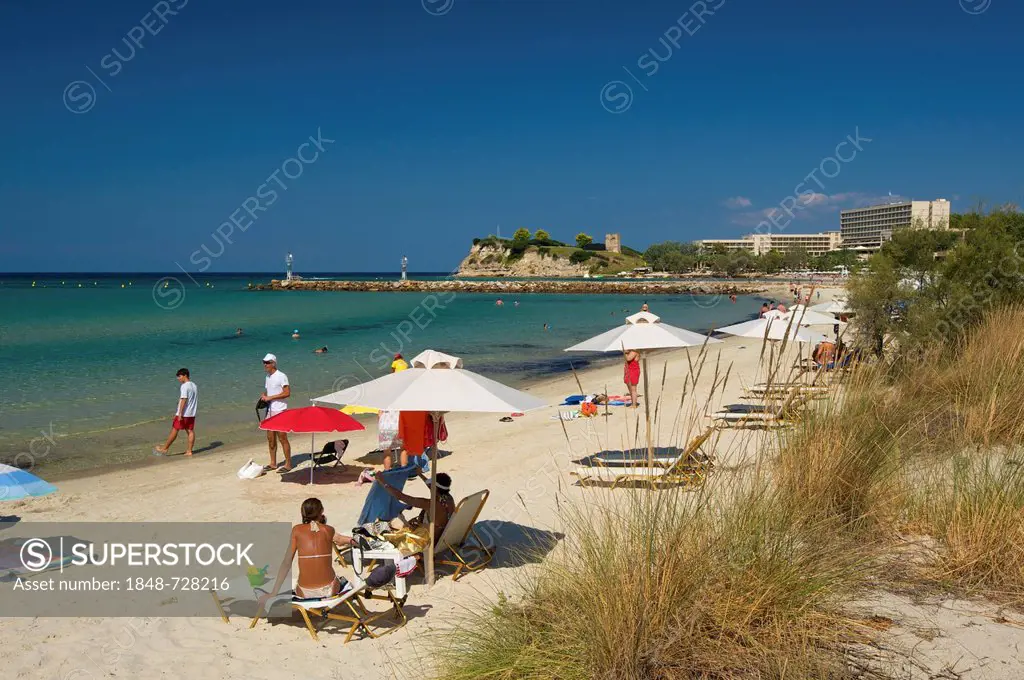 Tourists with umbrellas on the beach of Sani, Kassandra, Chalkidiki or Halkidiki, Greece, Europe