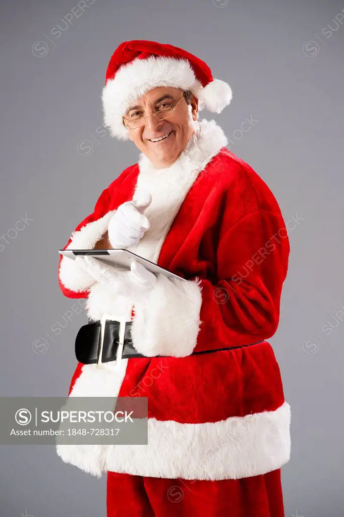 Santa Claus with a tablet PC