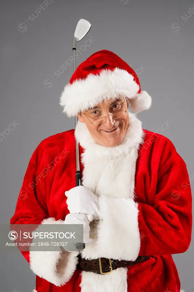 Santa Claus holding a golf club