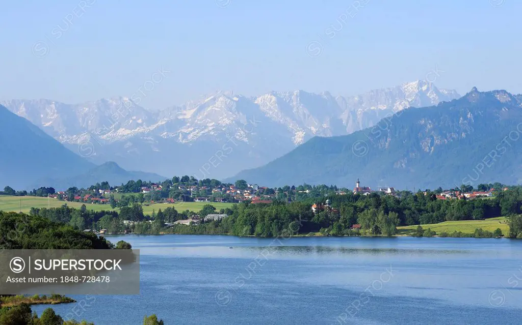 View of lake Riegsee and the Alps as seen from Aidlinger Hoehe, Blaues Land region, Upper Bavaria, Bavaria, Germany, Europe