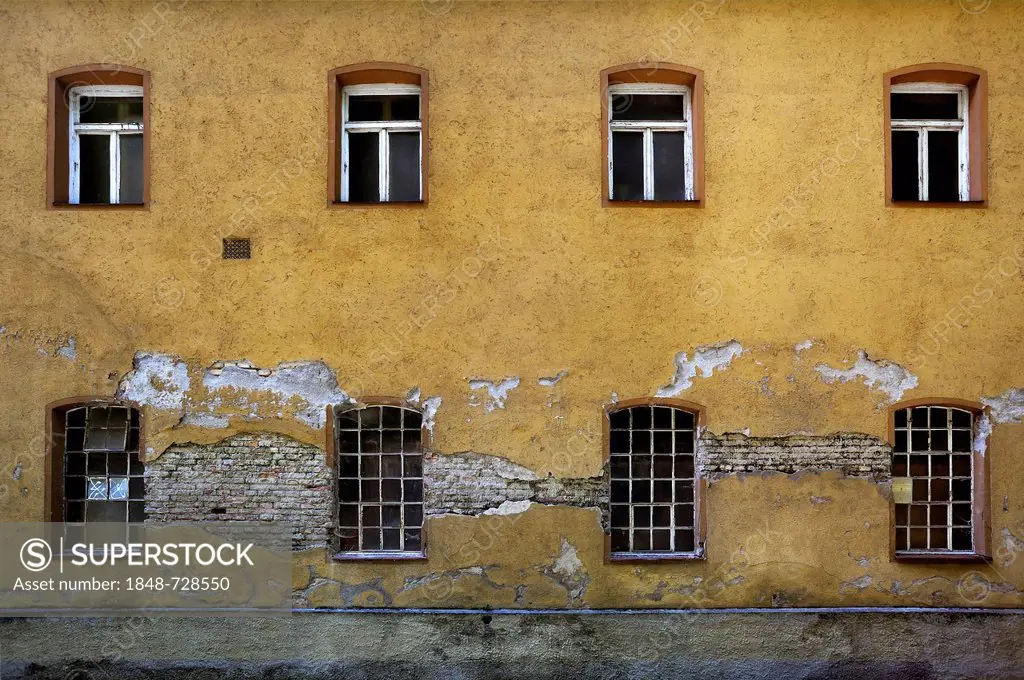 Facade on the Auer Muehlbach stream in need of renovation, Munich, Bavaria, Germany, Europe
