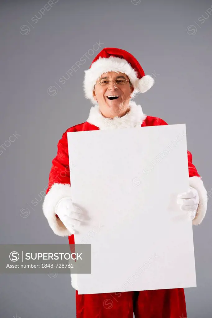Santa Claus presenting a blank slate