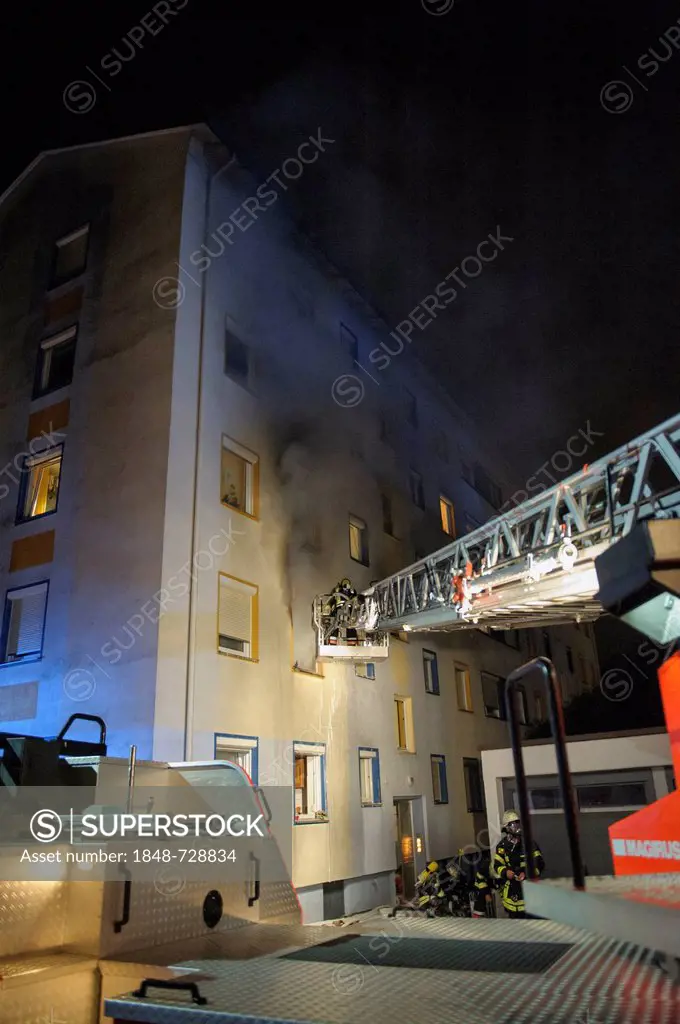 Apartment fire in an apartment building, firefighters rescueing people from a balcony, Esslingen, Baden-Wuerttemberg, Germany, Europe