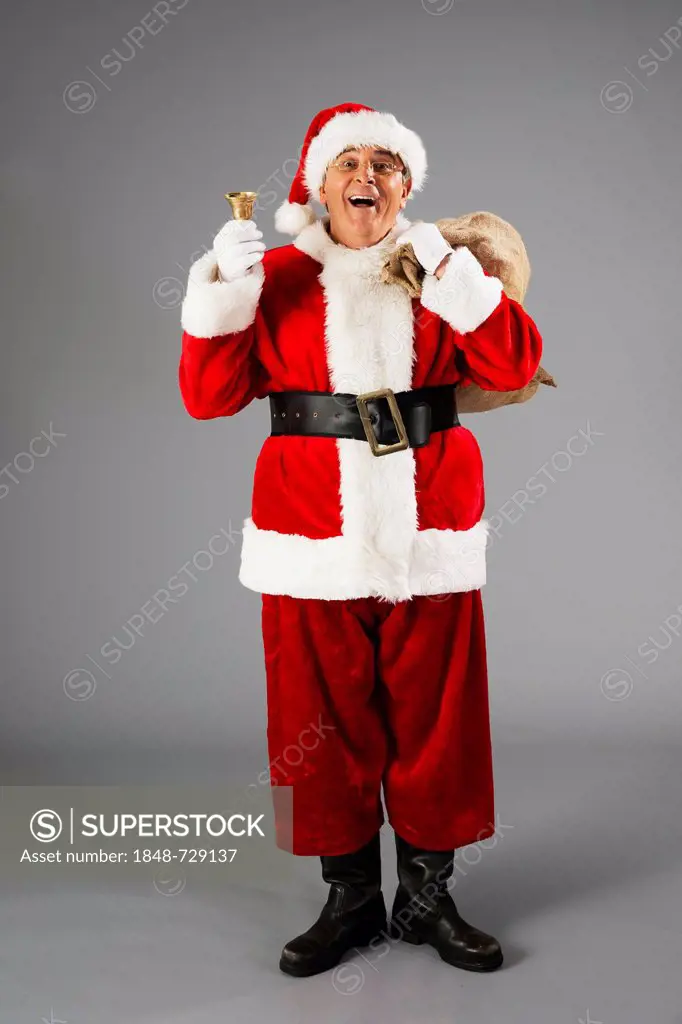 Santa Claus with bag and bell