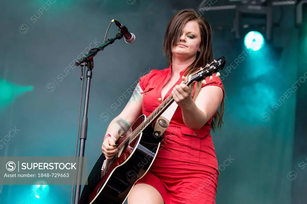 Marianne Sveen with a guitar from the Norwegian girl band Katzenjammer performing live at Heitere Open Air in Zofingen, Aargau, Switzerland, Europe