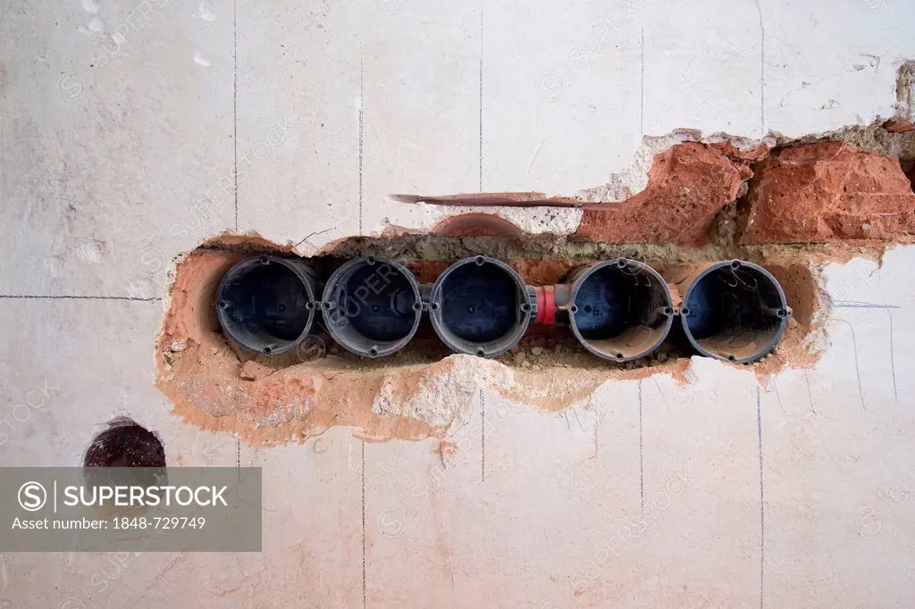 Preparatory work on a wall for installing new cable canals and sockets, electrical wiring in an old building, Stuttgart, Baden-Wuerttemberg, Germany, ...