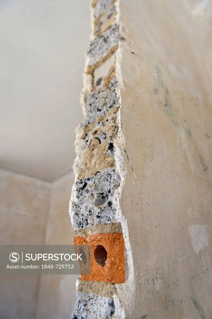 Cross-section through a plastered wall with brick, wall opening in an old building in need of renovation, Stuttgart, Baden-Wuerttemberg, Germany, Euro...