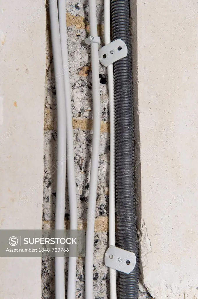 Electric cables laid in a cable canal to be flush under plaster in an old building, Stuttgart, Baden-Wuerttemberg, Germany, Europe