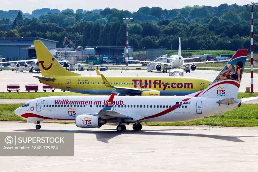 A XL Airways ITS Reisen Boeing 737 and a Tuifly Boeing 737, manoeuvring area of Duesseldorf International Airport, Duesseldorf, North Rhine-Westphalia...