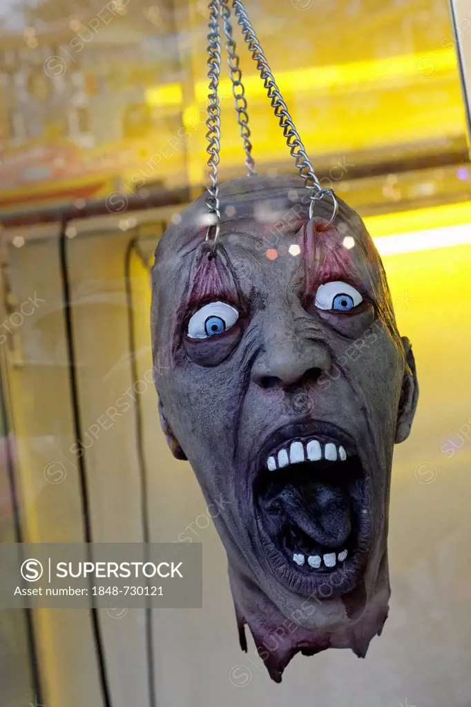 Decapitated head, suspended from chains, scary figure, ghost train, Rheinkirmes fun fair, Duesseldorf, North Rhine-Westphalia, Germany, Europe