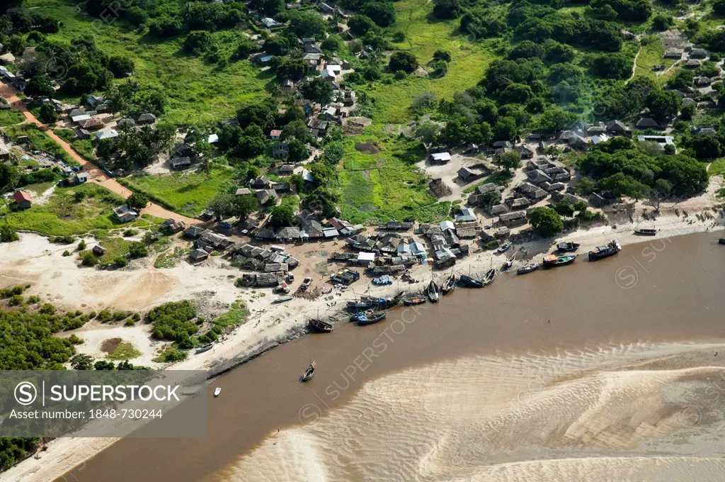Aerial view, fishing village and boats on the banks of a river, Pwani Region, Tanzania, Africa