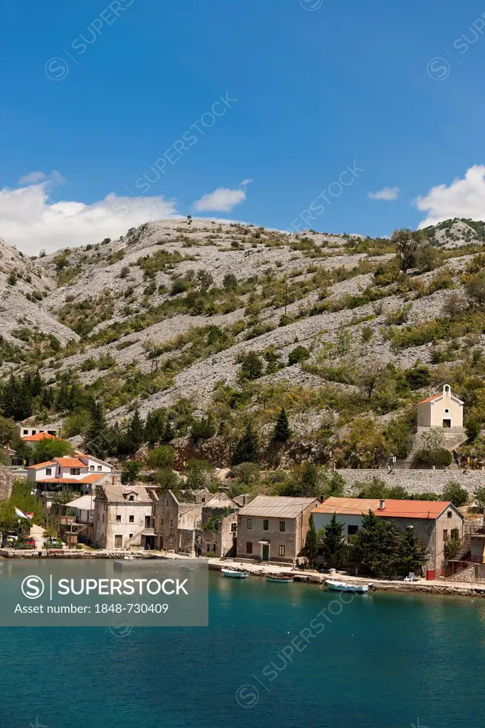 Newly constructed buildings and dilapidated houses standing close together, Lisarica, Dalmatia, Croatia, Southern Europe, Europe