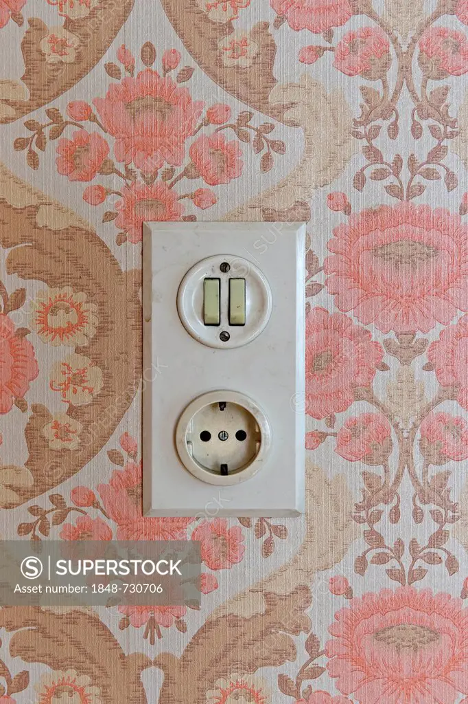 Old socket and light switch, wallpaper from the sixties, Stuttgart, Baden-Wuerttemberg, Germany, Europe