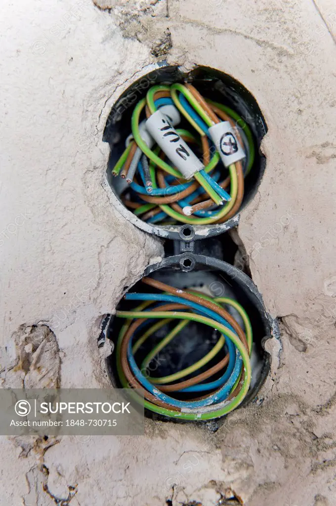 Electric cables in new socket holes to be flush under plaster in an old building, Stuttgart, Baden-Wuerttemberg, Germany, Europe