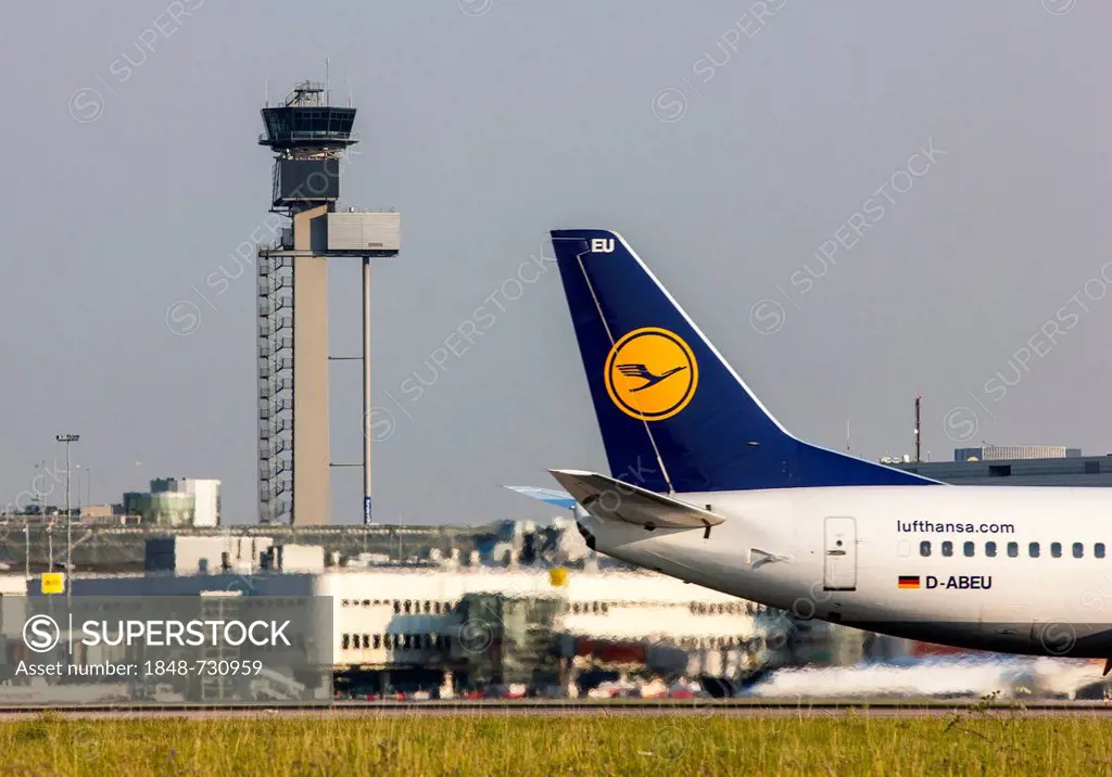 Tail unit of a Lufthansa Boeing 737, control tower, Duesseldorf International Airport, Duesseldorf, North Rhine-Westphalia, Germany, Europe