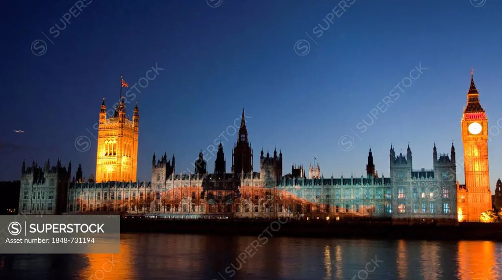 A giant image of US American swimmer Michael Phelps is projected onto the facade of the Houses of Parliament for the Olympic and Paralympic Games 2012...