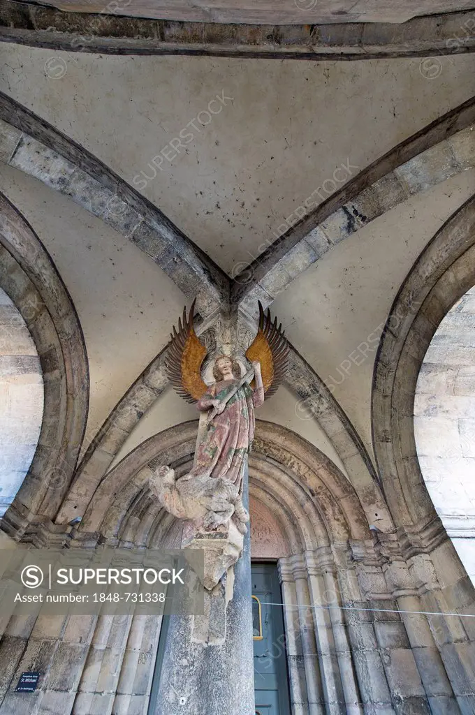 Archangel Michael, the guardian of justice, stone sculpture, 13th century, entrance, Church of St. Michael, a Protestant parish church, Schwaebisch Ha...