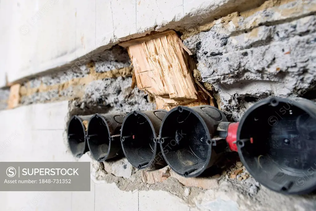 Preparatory work on a wall for installing new cable canals and sockets, flush mounting, electrical wiring in an old building, Stuttgart, Baden-Wuertte...