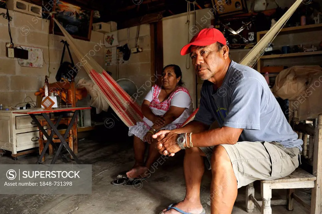 Couple sitting in their simple house, the man works as a garbage man, Cancun, Yucatan Peninsula, Quintana Roo, Mexico, Latin America, North America