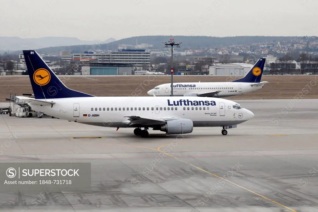 A Lufthansa D-ABIH Boeing 737-500 shortly after landing at the front and a Lufthansa D-ABJB Boeing 737-500 shortly before take off at the back, Stuttg...