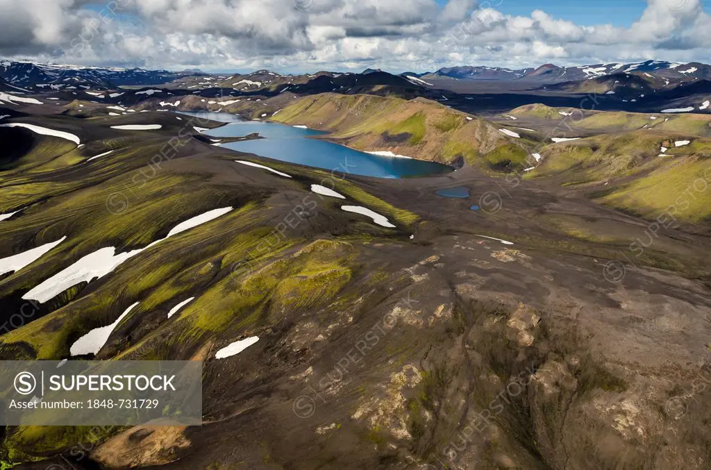 Aerial view, Lake Skyggnisvatn, moss-covered landscape with snow-covered mountains, Icelandic Highlands, Iceland, Europe