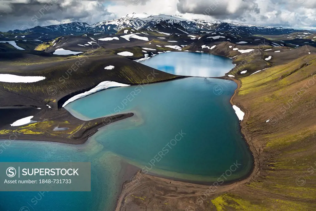 Aerial view, Lake Skyggnisvatn, moss-covered landscape and snow-covered mountains, Icelandic Highlands, Iceland, Europe